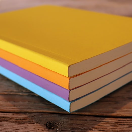 Eco-notebooks-in-yellow-orange-purple-blue